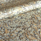 Printed marbled wrapping paper by Jemma Lewis Marbling. Marbled paper in earth tones of brown, sand, grey and soft blue.