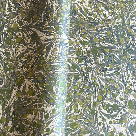 Printed marbled wrapping paper by Jemma Lewis Marbling. Marbled paper with a shimmery base paper and marbled pattern in green, lime and white