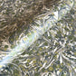 Printed marbled wrapping paper by Jemma Lewis Marbling. Marbled paper with a shimmery base paper and marbled pattern in green, lime and white
