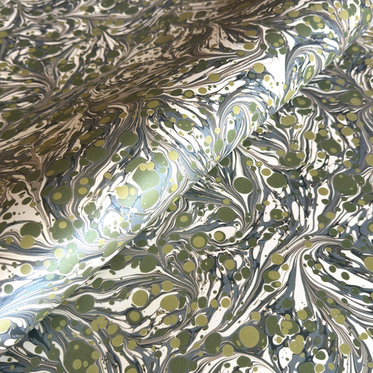 Printed marbled wrapping paper by Jemma Lewis Marbling. Marbled paper with a shimmery base paper and marbled pattern in green, lime and white