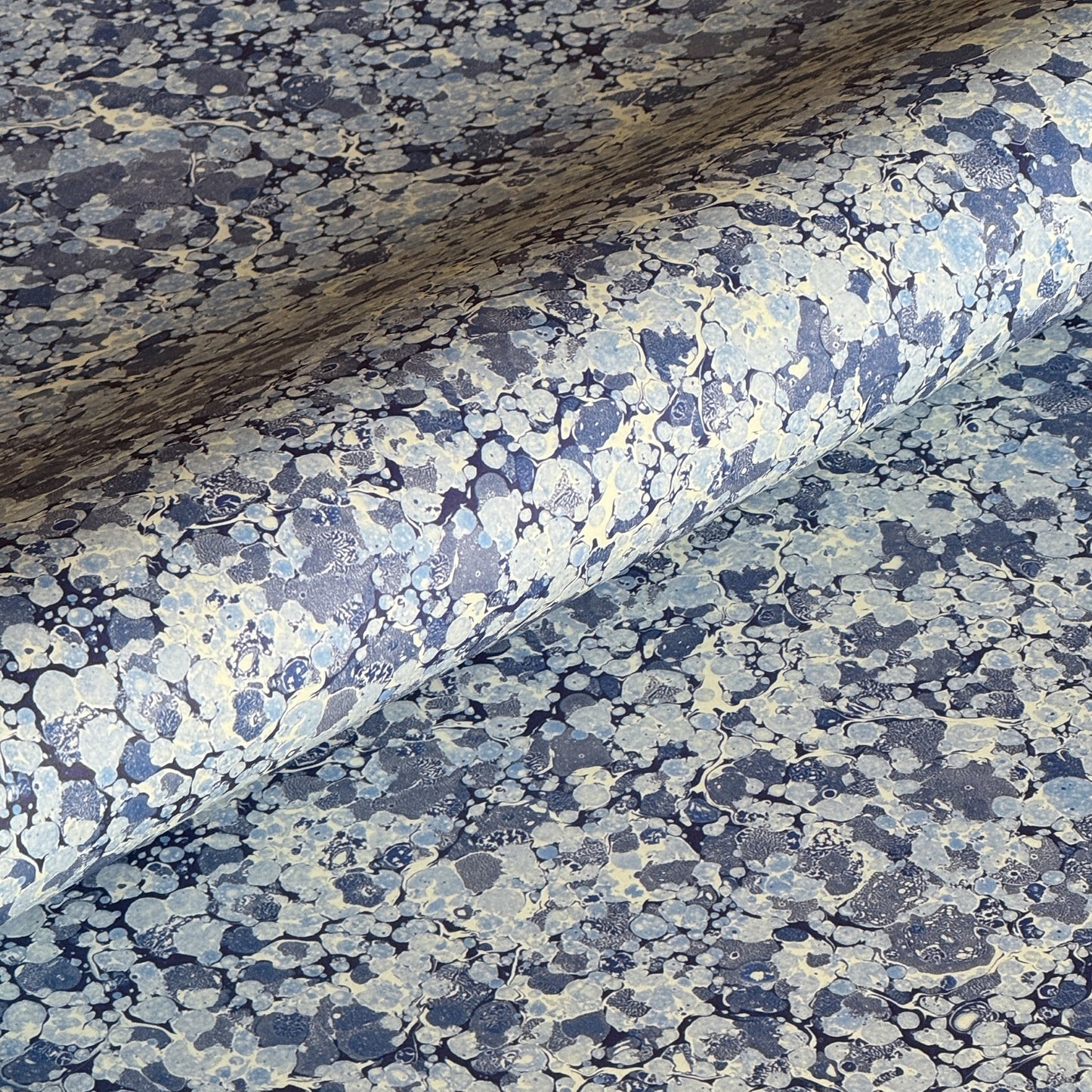 Printed marbled wrapping paper by Jemma Lewis Marbling. Marbled paper in blue and white