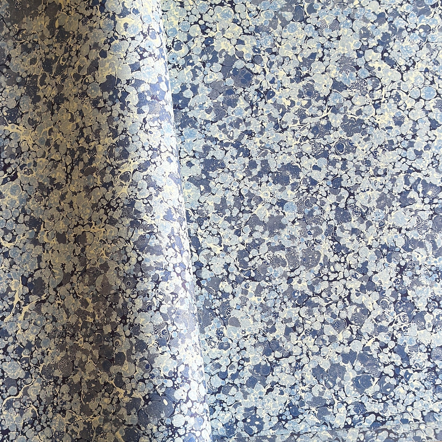 Printed marbled wrapping paper by Jemma Lewis Marbling. Marbled paper in blue and white