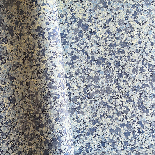 Printed marbled wrapping paper by Jemma Lewis Marbling. Marbled paper in blue and white