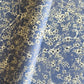 printed marble design wrapping paper by Jemma Lewis.  Daisy flower design in white and black on blue backdrop