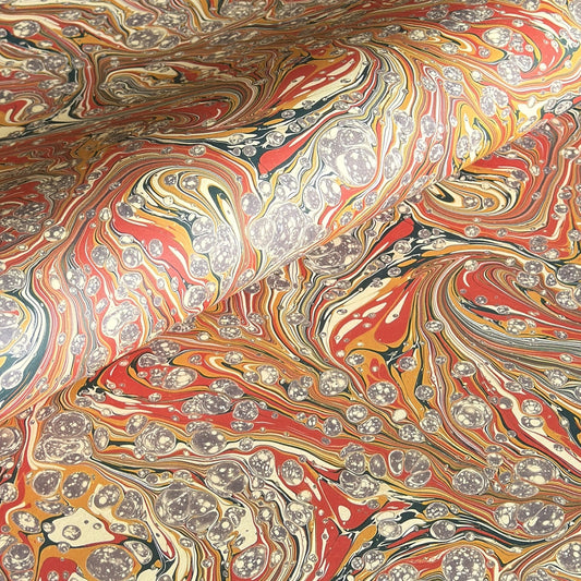 printed marbled design wrapping paper by jemma lewis.  marbled stone design in red, yellow and grey