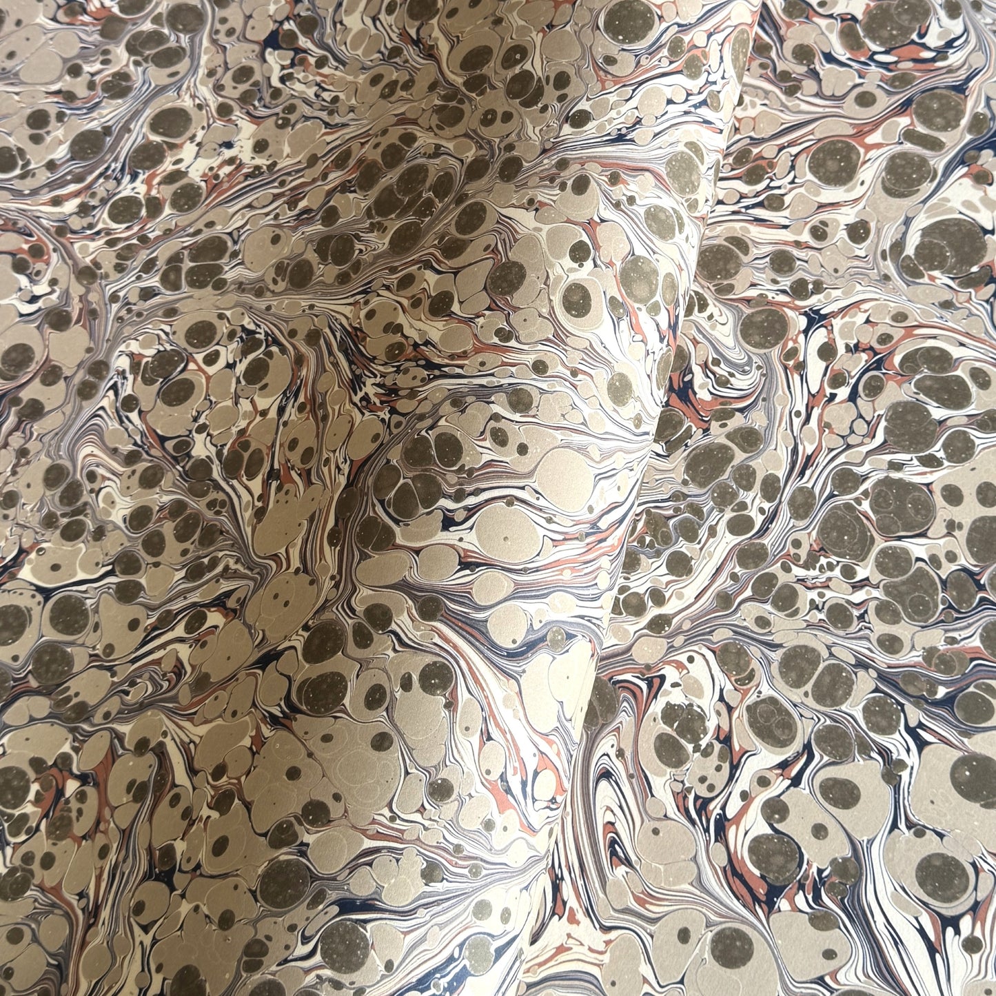 sheet of printed marbled wrapping paper by Jemma Lewis, stone effect in taupe, blush pink and beige
