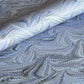 printed marbled wrapping paper by Jemma Lewis with a marbled pattern in blue and purple