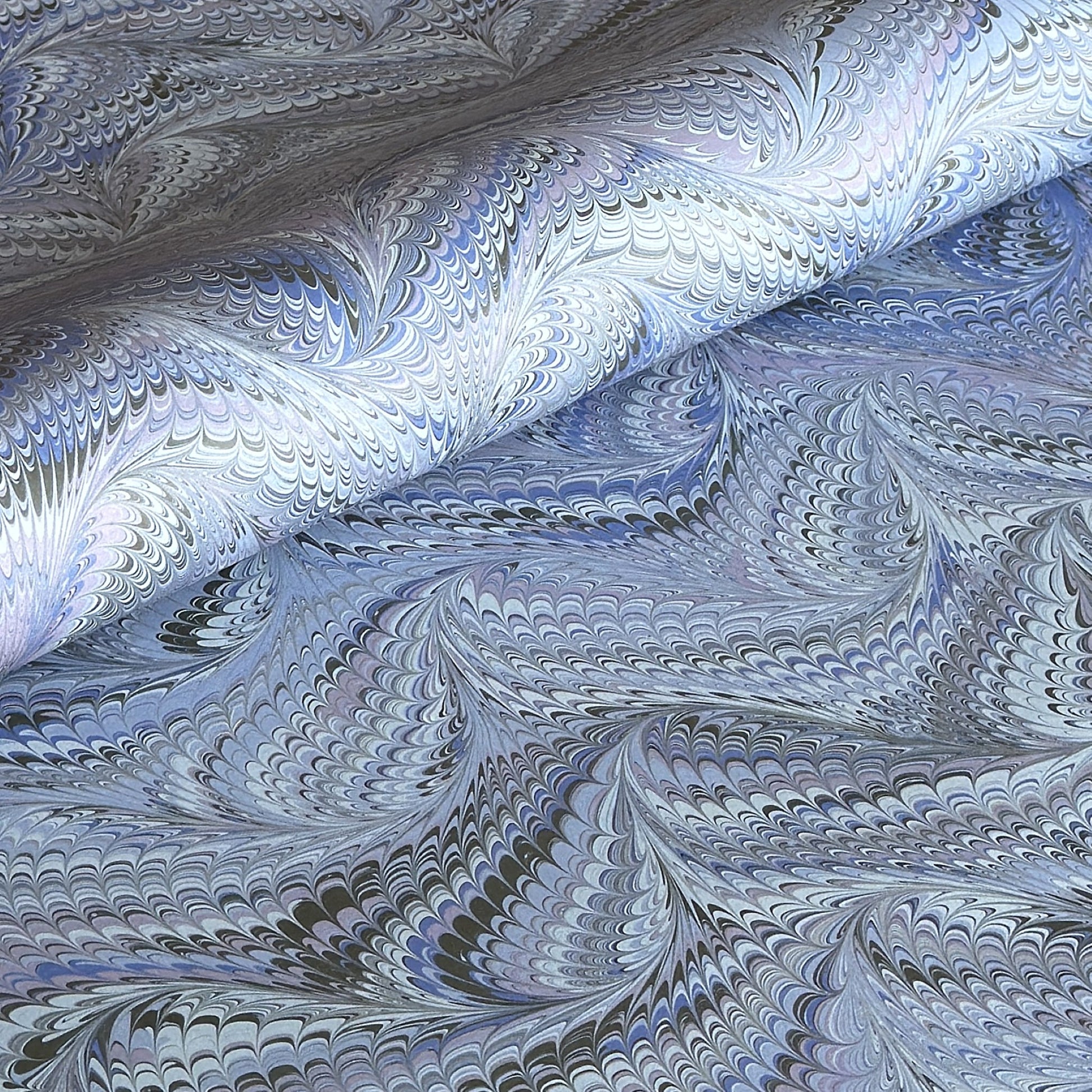 printed marbled wrapping paper by Jemma Lewis with a marbled pattern in blue and purple