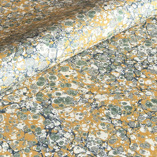 Printed marbled wrapping paper by Jemma Lewis Marbling. Marbled paper in soft greens, teal and yellow