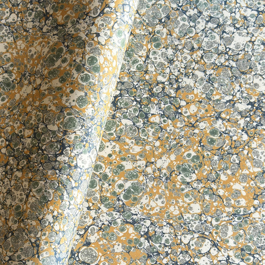 Printed marbled wrapping paper by Jemma Lewis Marbling. Marbled paper in soft greens, teal and yellow