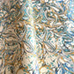 printed marbled wrapping paper with marbled pattern in aqua, blue, sand and cream.