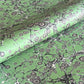 sheet of printed marbled wrapping paper by Jemma Lewis, stone effect in green and grey
