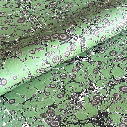 sheet of printed marbled wrapping paper by Jemma Lewis, stone effect in green and grey