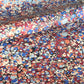 Printed marbled wrapping paper by Jemma Lewis Marbling. Marbled paper in bold red, blue and orange