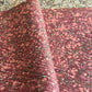 Printed marbled wrapping paper by Jemma Lewis Marbling. Marbled paper in deep burgundy, pinks and brown