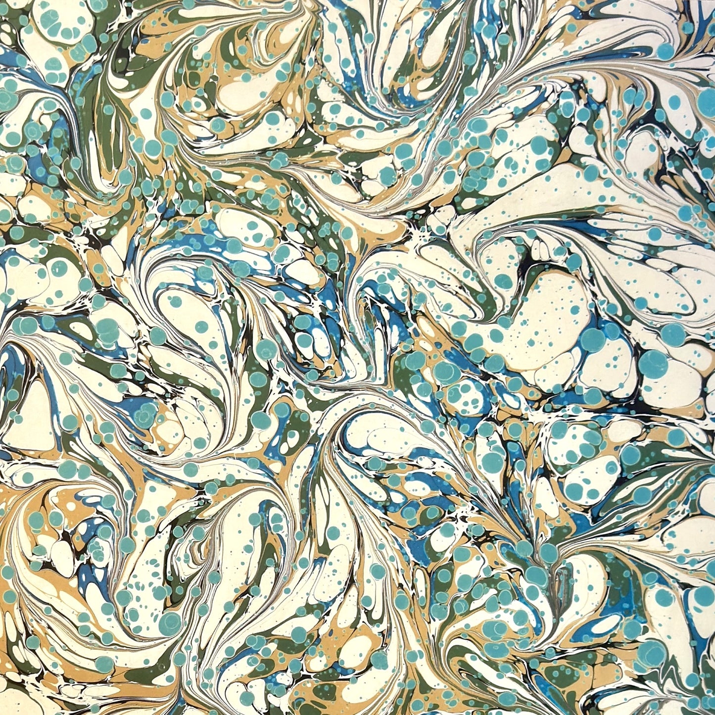 printed marbled wrapping paper with marbled pattern in aqua, blue, sand and cream