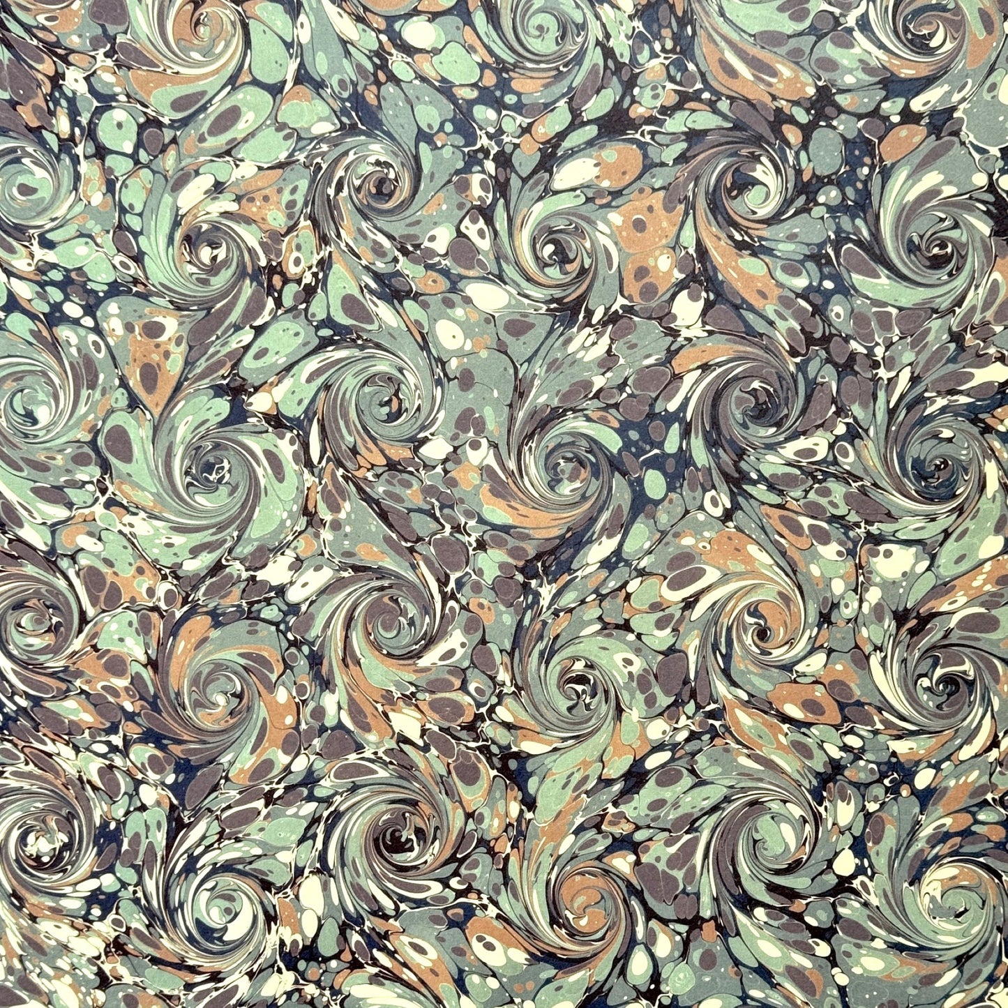 printed marble design wrapping paper by Jemma Lewis. Swirl design in inky greys and lichen greens