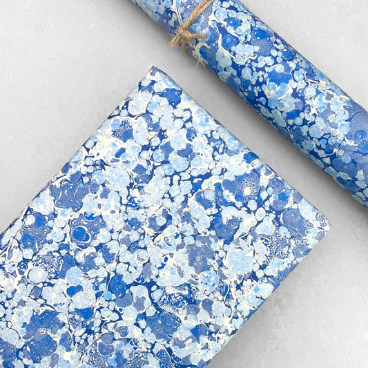 Printed marbled wrapping paper by Jemma Lewis Marbling. Marbled paper in blue and white