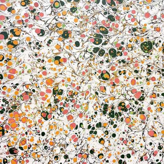 Printed marbled wrapping paper by Jemma Lewis Marbling. Marbled paper in bright yellow, pink and green on white backdrop.