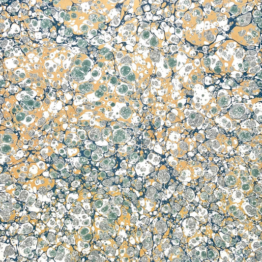 Printed marbled wrapping paper by Jemma Lewis Marbling. Marbled paper in soft greens, teal and yellow