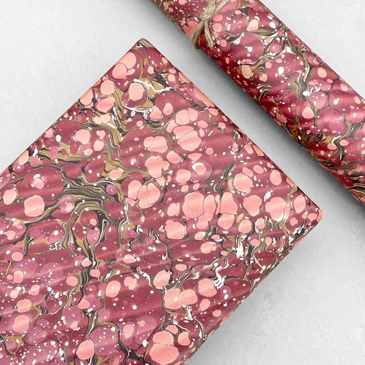 Printed marbled wrapping paper by Jemma Lewis Marbling.  Marbled paper in deep burgundy, pinks and brown