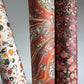 printed marbled design wrapping paper by jemma lewis.  marbled stone design in red, yellow and grey. Close up