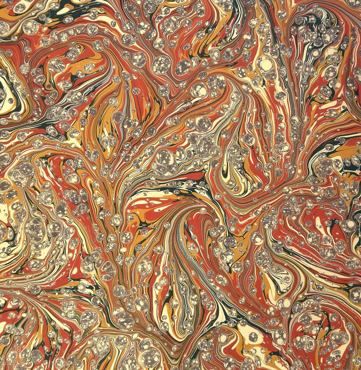 printed marbled design wrapping paper by jemma lewis.  marbled stone design in red, yellow and grey