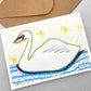 greetings card of a drawing of a swan on the water by John Austin Publishing