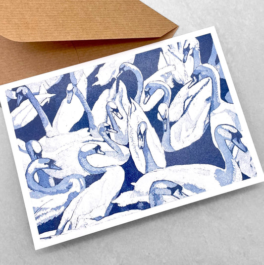 greetings card showing a group of swans in the water by John Austin Publishing