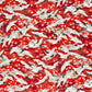 Japanese silkscreen chiyogami paper with a repeat pattern of white cranes in flight on a red and silver background