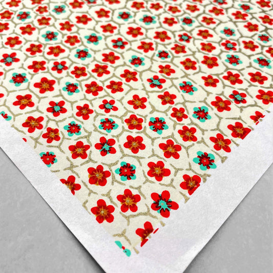 japanese silk-screen handmade paper, chiyogami, with red and aqua plum flowers repeat pattern