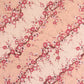 Diagonal branches of pink plum (ume) blossom on a light pink background with gold accents. Japanese chiyogami paper