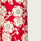 a sheet of chiyogami paper with a modern design of plum blossom in red and cream