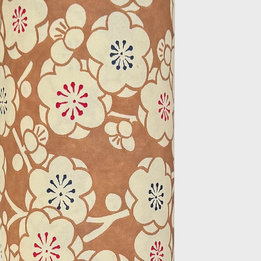 a sheet of Japanese chiyogami paper with a modern interpretation of plum blossom in taupe and cream