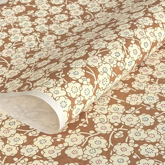 a sheet of Japanese chiyogami paper with a modern interpretation of plum blossom in taupe and cream