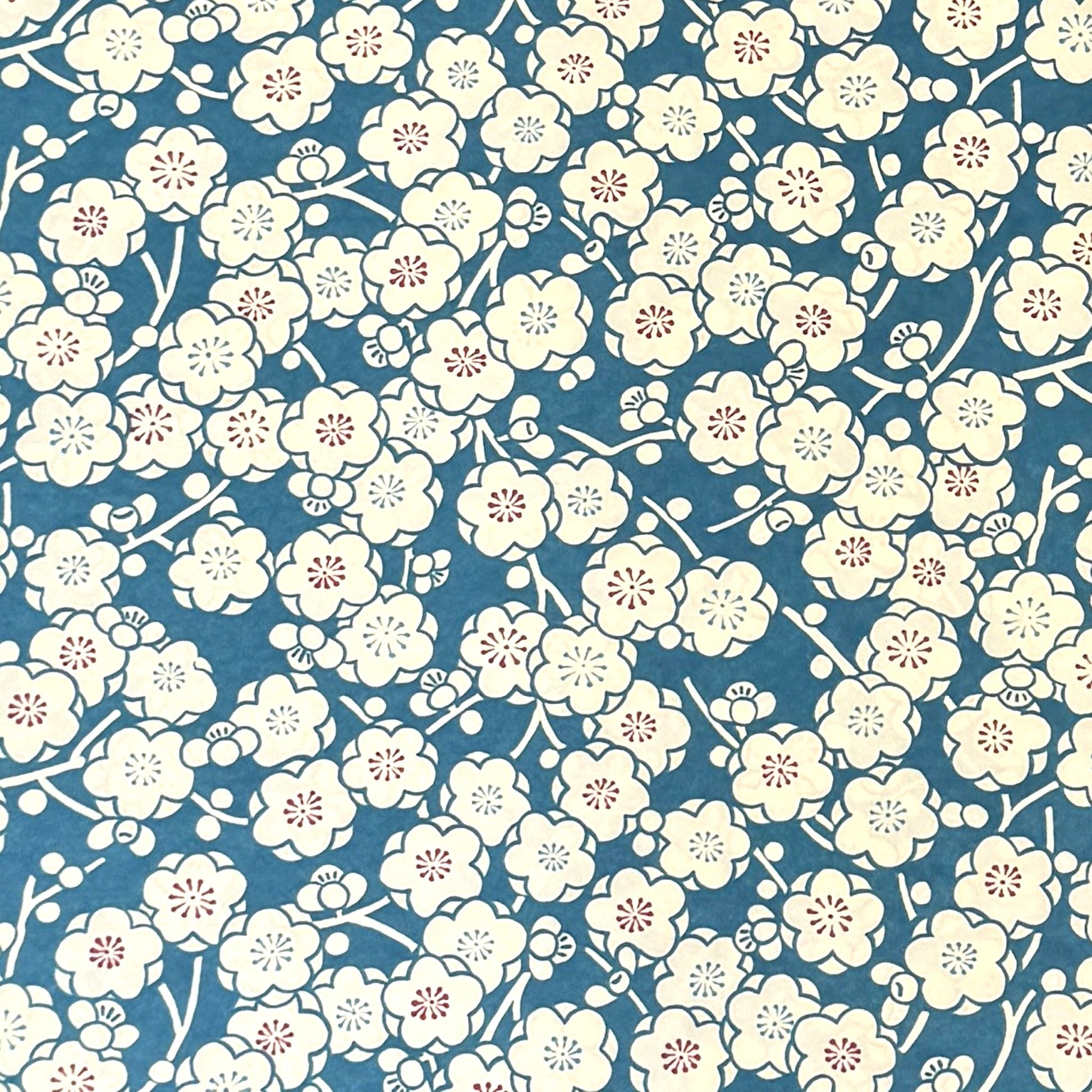 a sheet of chiyogami paper with a modern plum blossom pattern in aqua and cream