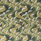 a sheet of Japanese chiyogami paper with white cranes flying on a dark green and gold swirl background