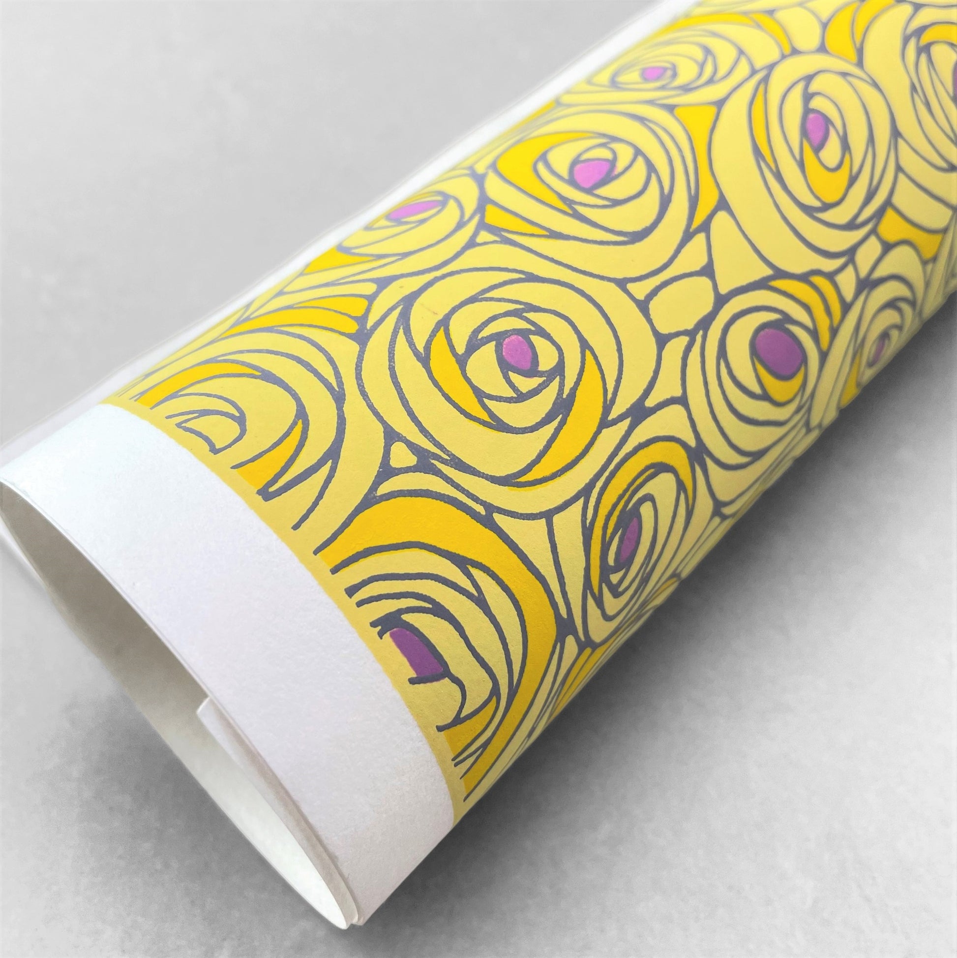 japanese silk-screen handmade paper, chiyogami, showing yellow and lilac abstract floral pattern