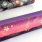 japanese chiyogami paper in stripes of pink, lilac and purple with gold clouds and flowers. Rolled