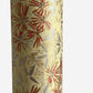 Pattern of scattered pine needles (matsuba) in gold and silver on a cream backdrop. Japanese chiyogami paper.