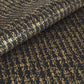 a sheet of Japanese chiyogami paper with gold Japanese kanji text on black background