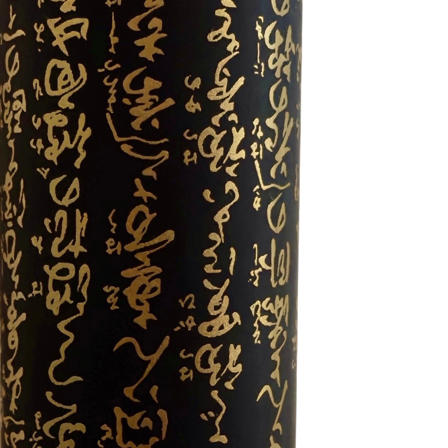 a sheet of Japanese chiyogami paper with gold Japanese kanji text on black background