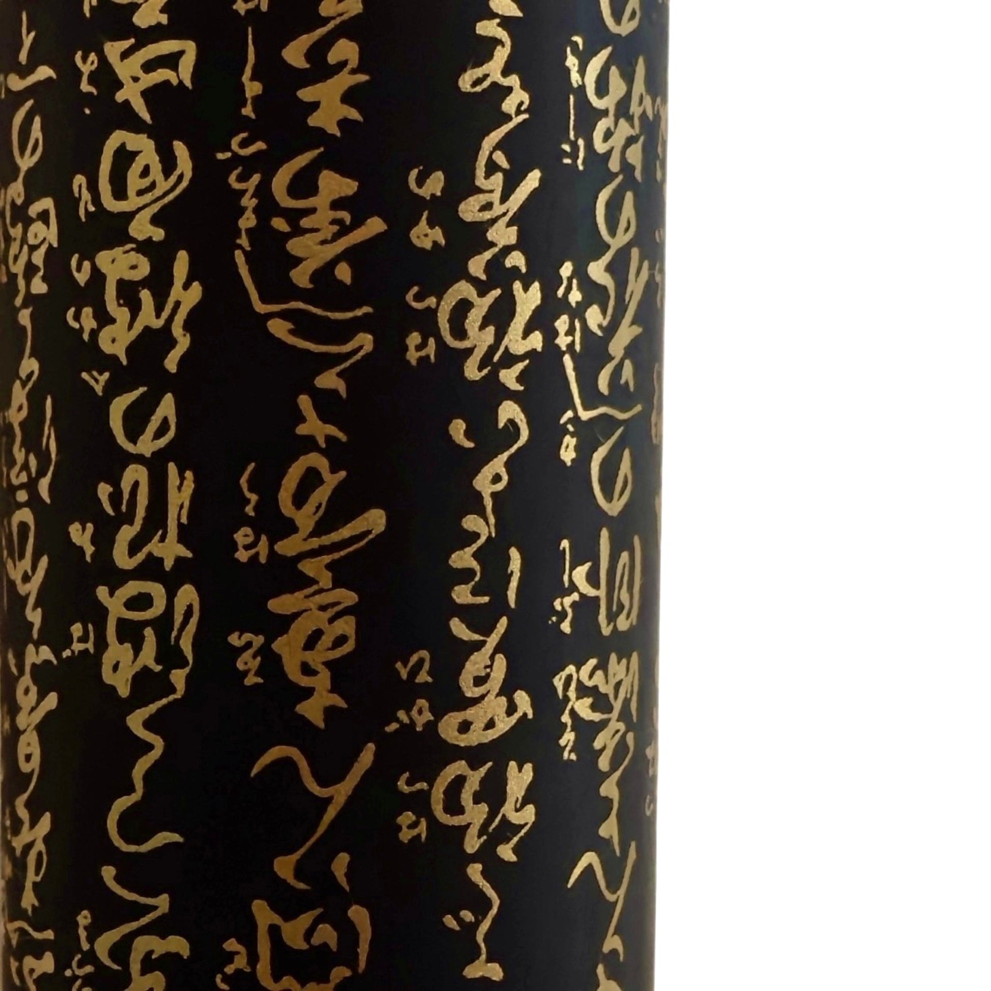 a sheet of Japanese chiyogami paper with gold Japanese kanji text on black background