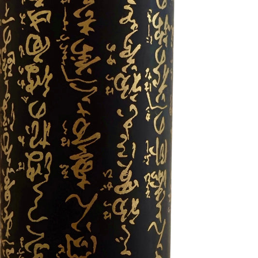 a sheet of Japanese chiyogami paper with gold Japanese kanji text on black background