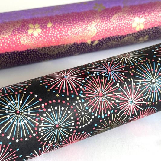 Colourful fireworks (hanabi) on a black background. Japanese chiyogami paper. Rolled