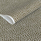 a sheet of chiyogami paper with a mocha brown background and little white stylised cherry blossom flowers
