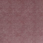 a sheet of Japanese chiyogami paper with an aubergine background and a small repeat pattern of tiny white dots in an arch shape