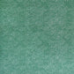 a sheet of Japanese chiyogami paper with a forest green background and a small repeat pattern of tiny white dots in an arch shape