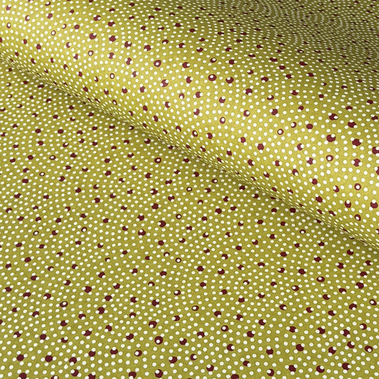a sheet of Japanese chiyogami paper with an olive backdrop and a white dotted repeat arch pattern with red dots