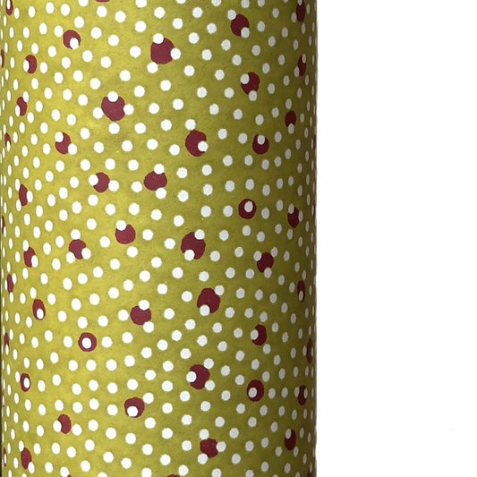 a sheet of Japanese chiyogami paper with an olive backdrop and a white dotted repeat arch pattern with red dots